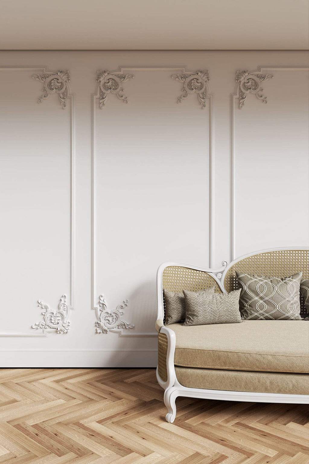 Beige sofa with patterned cushions against a decorative wall with floral designs.