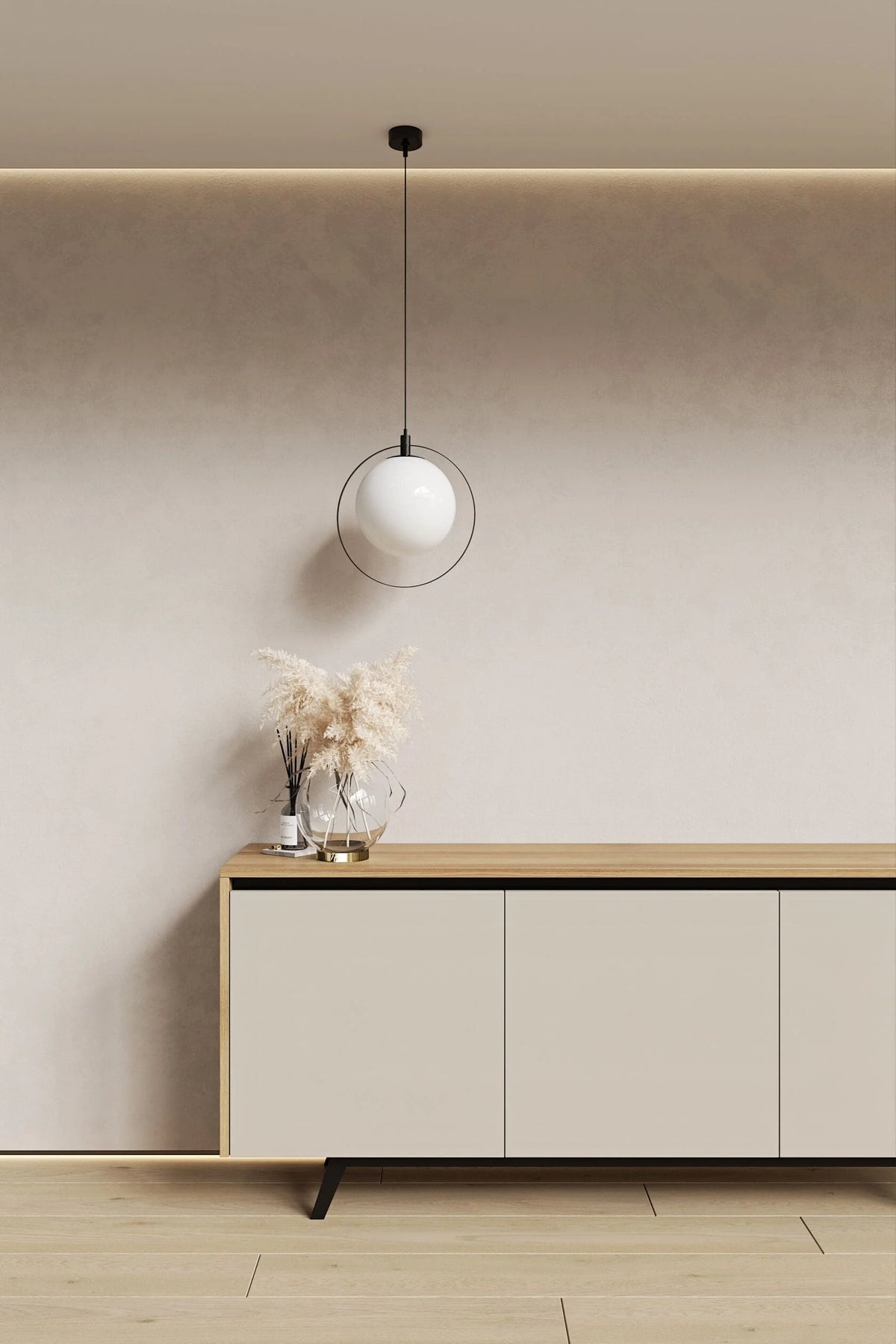 Modern interior with a light-colored sideboard, pendant lamp, and decorative items against a neutral wall.